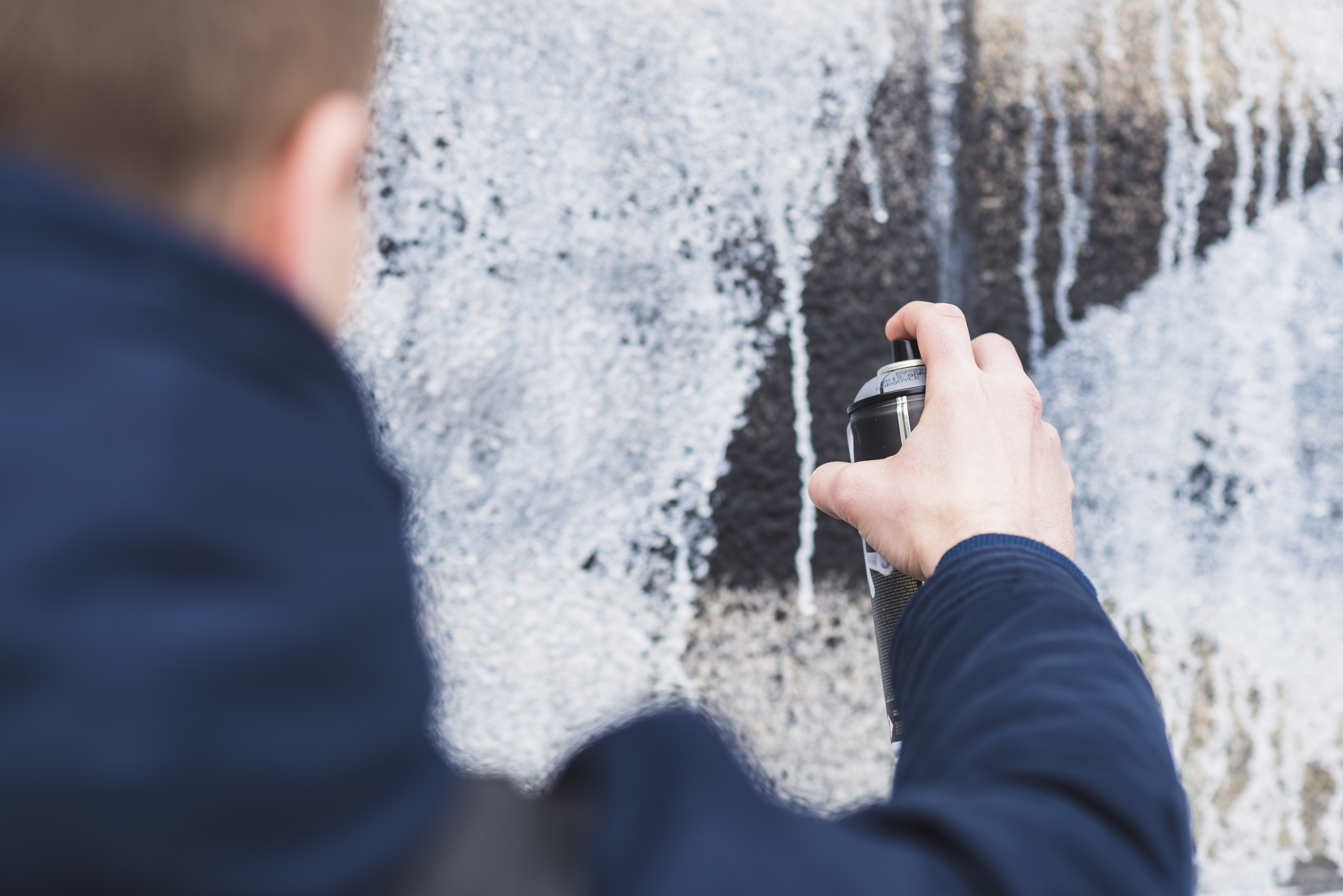 Person pointing at building